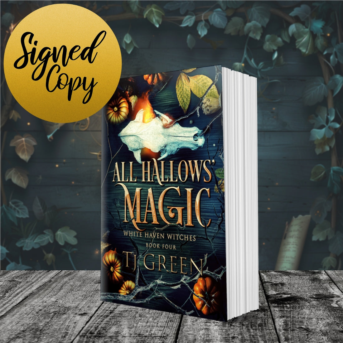 Book titled 'All Hallows' Magic' by T. Green with a signed copy label on a wooden surface and leafy background. Books about witches, fiction, Halloween, Samhain Magic.