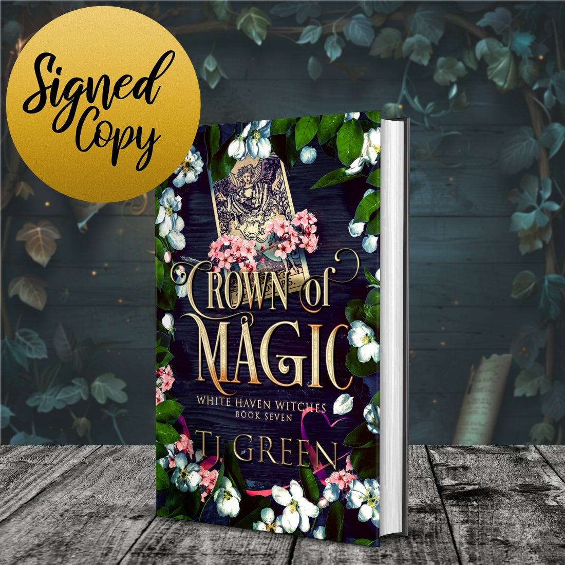 Book titled 'Crown of Magic' by TJ Green with floral design on a wooden surface. Witchcraft, magic, paranormal fantasy, supernatural suspense.