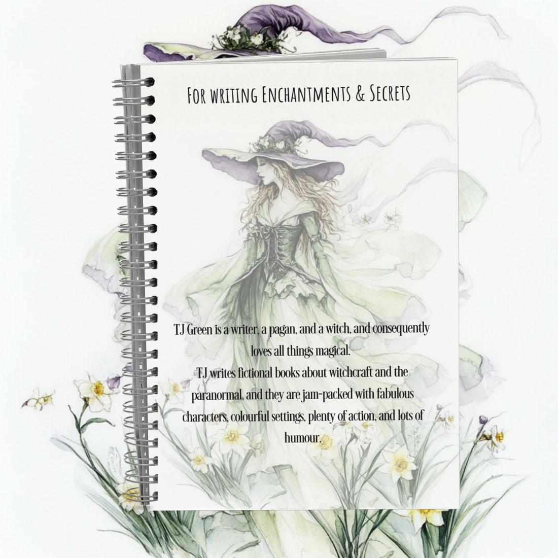 Notebook with a witch illustration and text on a white background
