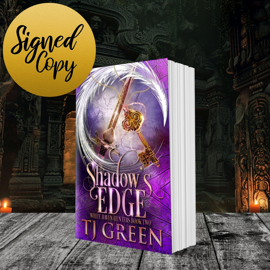 Book titled 'Shadow's Edge' by TJ Green with a purple cover featuring keys, on a dark background. Urban Fantasy series.
