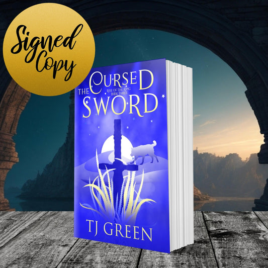 Book titled 'The Cursed Sword' by TJ Green with a scenic background YA Arthurian fantasy.