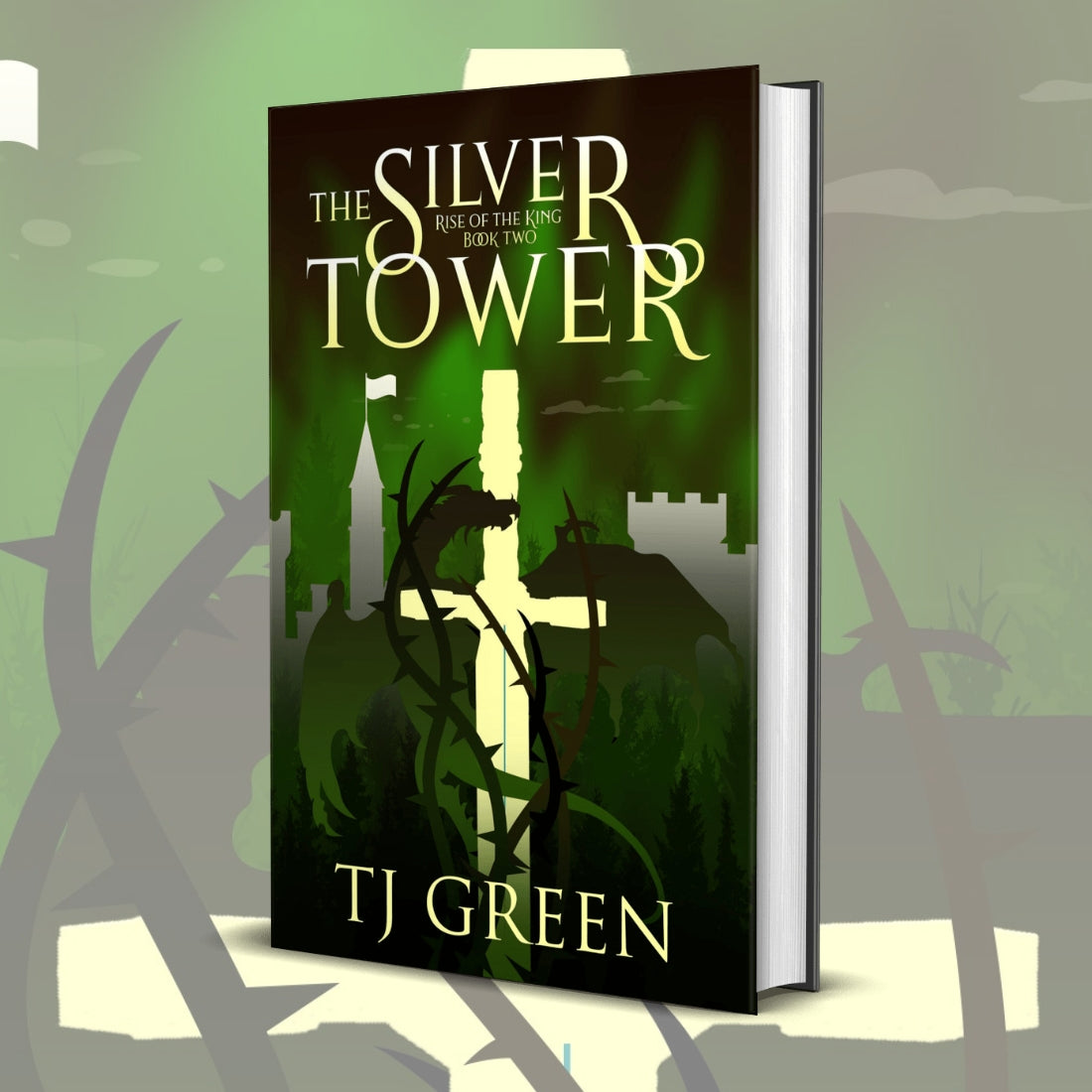 Book titled 'The Silver Tower' by TJ Green on a green background Rise of the King #2, Arthurian Fantasy, Magic, dragons, adventure, Merlin.