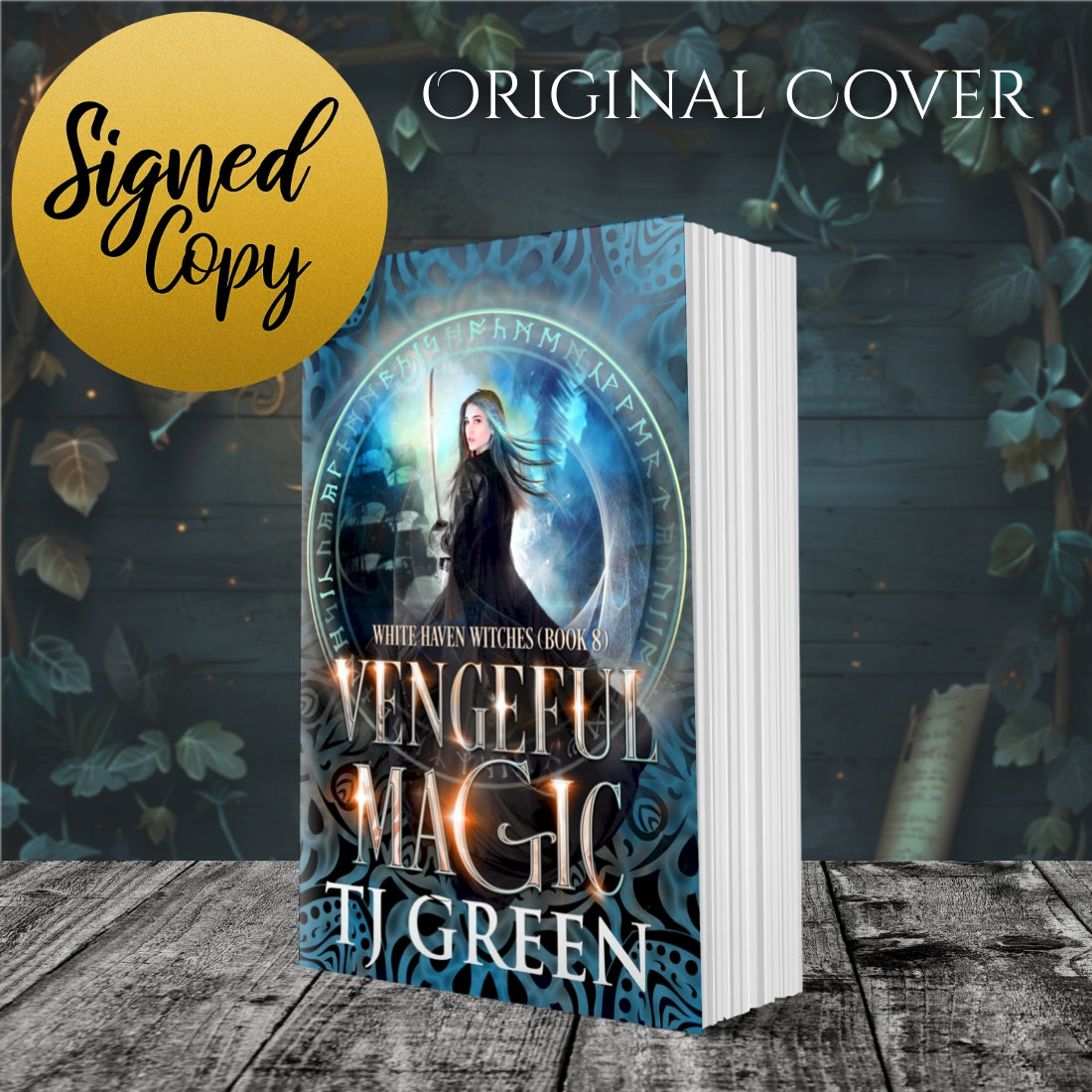 Book titled 'Vengeful Magic' by TJ Green with a mystical cover design on a wooden surface. Paranormal witch fiction, supernatural mystery, urban fantasy.
