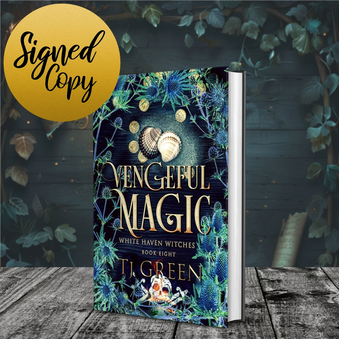 Book titled 'Vengeful Magic' with decorative cover and 'Signed Copy' label on a wooden surface. Witchcraft, magic, paranormal mystery.
