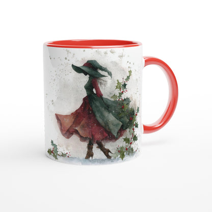 Mug with a winter scene design featuring a person in a red coat and green hat, on a white background.