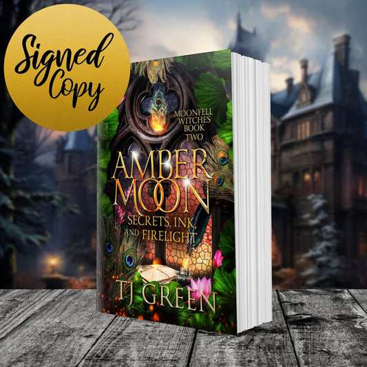 Amber Moon paperback book on wooden shelf with Moonfell House in the background. paranormal mystery, dual timeline, urban fantasy