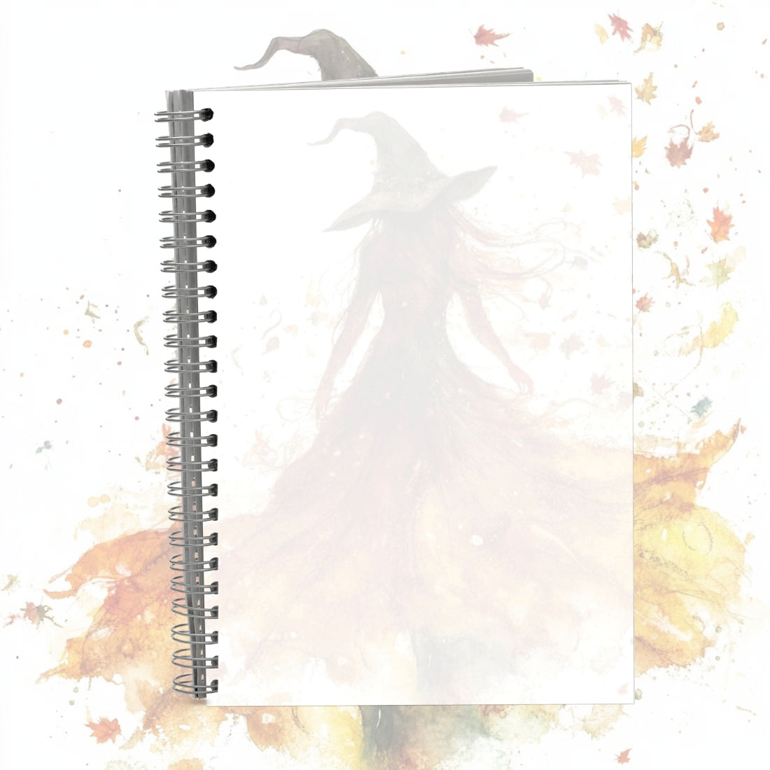 Notebook with a decorative cover featuring a ghost and autumn leaves on a white background
