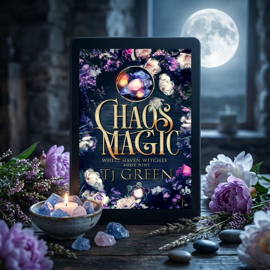 E-reader displaying 'Chaos Magic' book cover with flowers and candles on a wooden table.