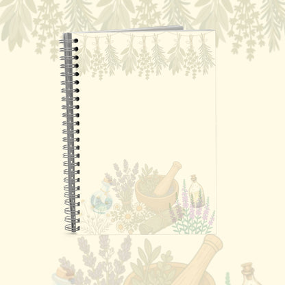 A spiral-bound notebook with a botanical illustration on the cover, featuring herbs, flowers, a mortar and pestle, and small glass bottles. The notebook is shown against a matching cream-colored background with a subtle, faded version of the same illustration.