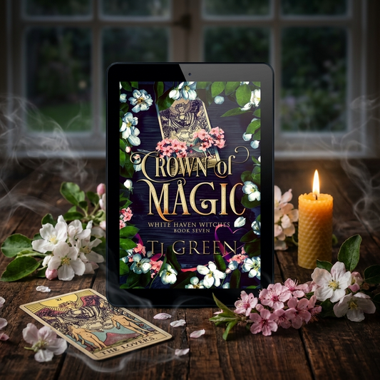 E-reader displaying 'Crown of Magic' on a wooden table with flowers and a candle.