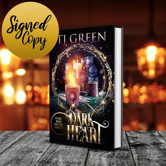 Book titled 'Dark Heart' by Ti Green with a blurred background Paranormal wolf shifter mysteries and urban fantasy