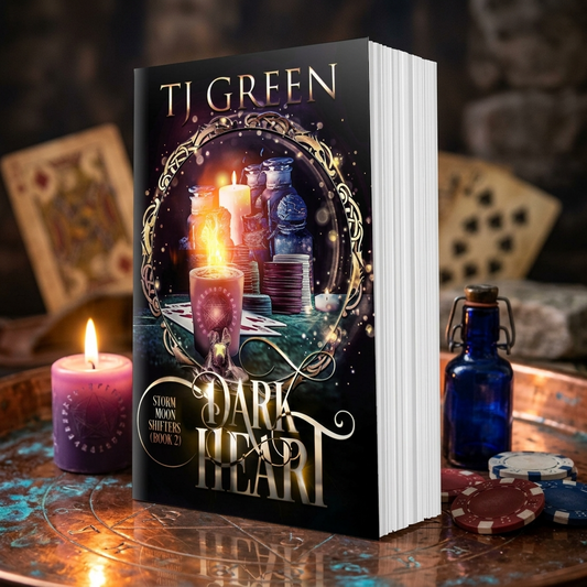 Book titled 'Dark Heart' by T.J. Green on a mystical table with candles and cards.