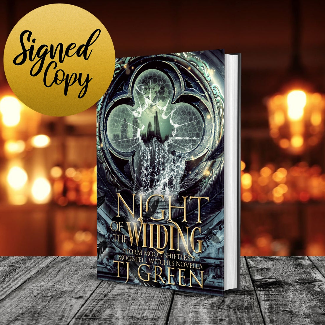 Book titled 'Night of the Wilding' by T.J. Green with a blurred background