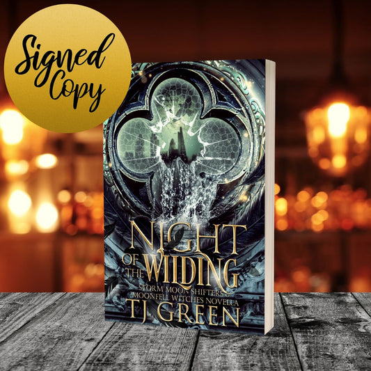 Book titled 'Night of Wilding' by TJ Green with a blurred background