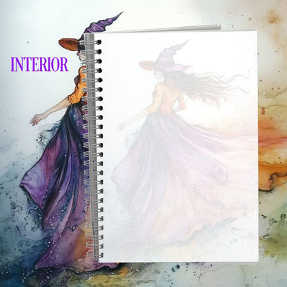 Spiral-bound notebook with artistic cover featuring two figures, one in a purple dress and the other in white, on a textured background.