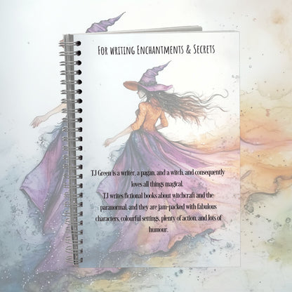 Notebook with a witch illustration and text on a pastel background