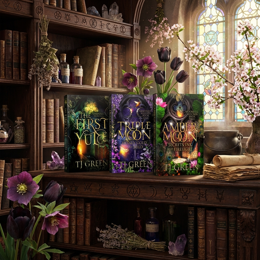 Three books titled 'The First Yule', 'Triple Moon', and 'Amber Moon' by T.J.