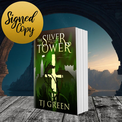 Book titled 'The Silver Tower' by TJ Green with a scenic background YA Arthurian Fantasy