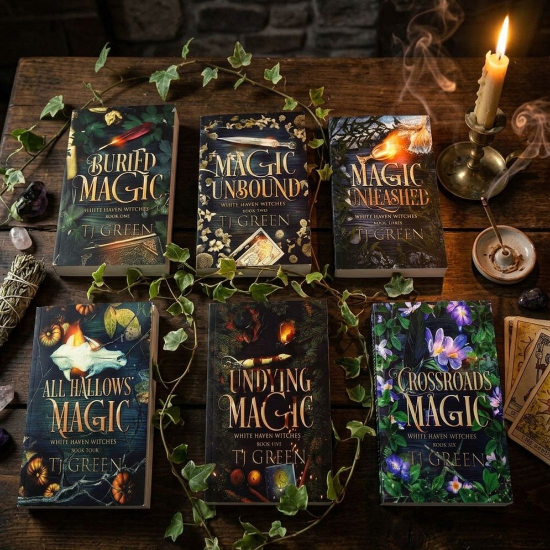 Collection of books titled 'Magic Unbound', 'Magic Unleashed', 'All Hallows Magic', 'Finding Magic', and 'Crossroads Magic' on a wooden surface with decorative elements.