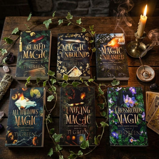 Collection of books titled 'Magic Unbound', 'Magic Unleashed', 'All Hallows Magic', 'Finding Magic', and 'Crossroads Magic' on a wooden surface with decorative elements.