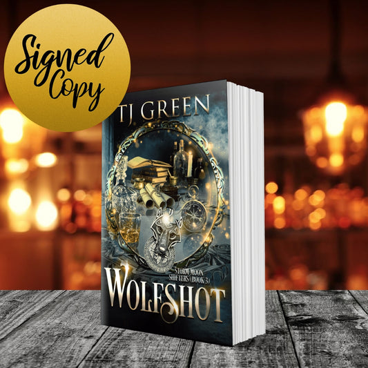 Book titled 'Wolfshot' by TJ Green with a blurred background Paranormal Wolf shifter mystery