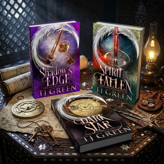 Three fantasy book covers by TJ Green are arranged on a dark carved table with rolled scrolls, keys, a lantern, and other vintage props. The visible titles are Shadow's Edge, Spirit of Fallen, and Dark Star.